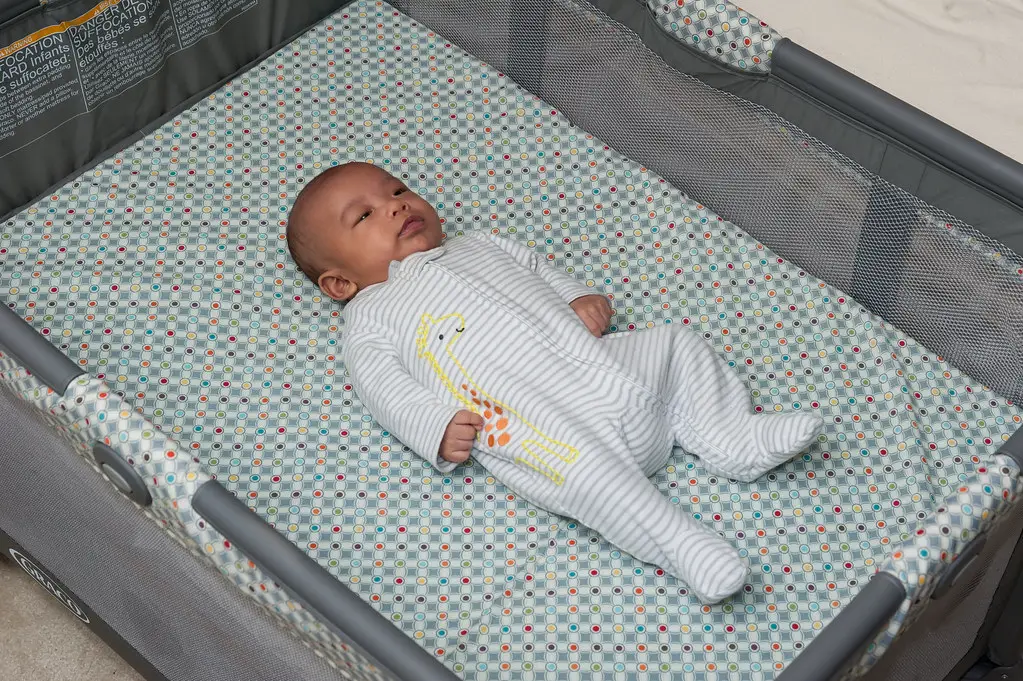 A Baby On Comfortable Crib Mattress